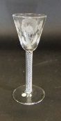 A mid 18th Century wine glass, the bowl as a round funnel with engraving of two rose buds,