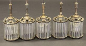 A set of five early to mid 20th Century ceiling lights, each supported on a pendant fitting with