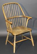 A 19th Century West Country ash and elm stick back elbow chair on turned legs united by an H-