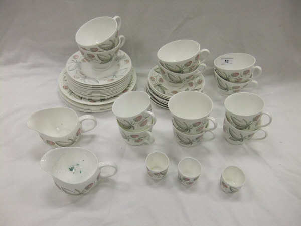 A collection of Susie Cooper "Strawberry" pattern tea wares to include two jugs, various plates,