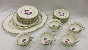 A Royal Worcester "The Chamberlain" part tea set with puce printed decoration and scrolling