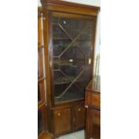 A circa 1900 mahogany corner cabinet,