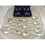 A cased set of six Edwardian silver bright cut teaspoons and sugar tongs,