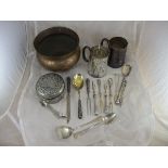 A collection of foreign white metal and other cutlery to include straining spoon, pusher,