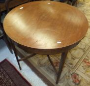 An early 20th Century mahogany and inlaid circular occasional table on square tapered legs united