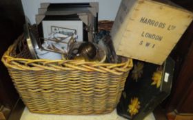 A large wicker basket containing an assortment of various sundry items to include curtain rail ends,