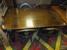 An Ercol style dining table and five chairs, court cupboard,