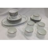 A collection of Hermes "Rythme" pattern porcelain dinner wares to include oval platter, six