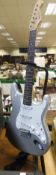 An Aria STG Series Stratocaster copy electric guitar, silver bodied,