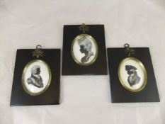 A pair of reproduction silhouettes, one of Marie Antoinette, the other Louis XVIII,