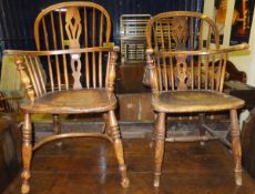 A matched pair of 19th Century West Country ash and elm elbow chairs with spindle back and central