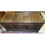 An 18th Century oak coffer, the rectangular four panel top above four further front panels,