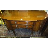 A reproduction break front sideboard with two drawers flanked by cupboard doors