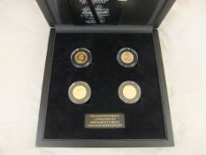 A boxed set of four gold sovereigns - "The Gold Sovereign Landmarks of Her Majesty's Reign,
