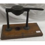 A Victorian lemon squeezer by W Thornhill & Co on an oak base (Rg. No.