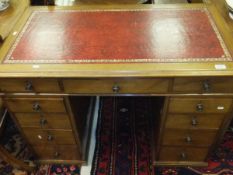 A circa 1900 mahogany pedestal desk, the tooled and gilded red leather insert above a central drawer