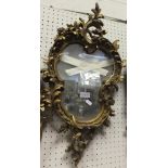 A giltwood and gesso wall mirror in the Rococo taste CONDITION REPORTS Overall with quite a lot of