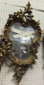 A giltwood and gesso wall mirror in the Rococo taste CONDITION REPORTS Overall with quite a lot of