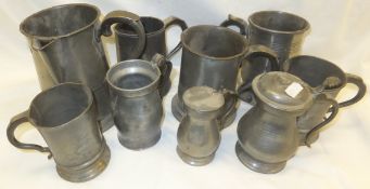 A selection of pewter mugs,