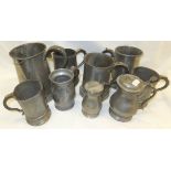 A selection of pewter mugs,