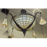 A pearlescent glass and coppered ceiling light in the Tiffany manner,