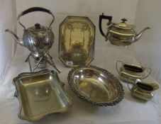 A collection of plated wares to include spirit kettle, three piece tea set, octagonal tray, etc.