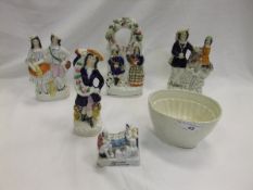 A collection of four Staffordshire pottery flat back figures to include a pocket watch holder,