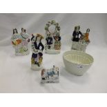 A collection of four Staffordshire pottery flat back figures to include a pocket watch holder,