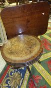 A Victorian mahogany snap top tea table on a pedestal tripod base and a reproduction drum style