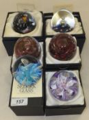 A collection of six Selkirk Glass paperweights - "Satin" 1995 (blue), "Satin" 1991 (purple),