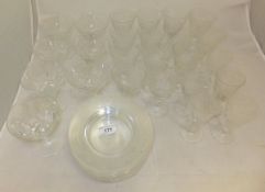 A suite of oak leaf and acorn etched cut glass to include plates and three sizes of glass,