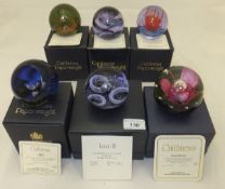 A collection of six Caithness glass paperweights - "Alpha", No'd. 192/750, "Bolero", No'd.