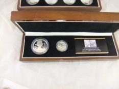 A "The Diamond Jubilees of two Queens 1897 and 2012" silver commemorative set of two coins, (boxed),