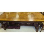 A large oak refectory style three-plank dining table in the 17th Century manner, on ringed and