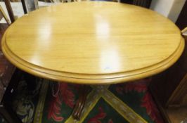 A Victorian mahogany oval centre table on turned central pedestal to hipped quadruped base