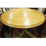 A Victorian mahogany oval centre table on turned central pedestal to hipped quadruped base