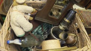 A basket and contents of various sundries including two straw boaters, oak hall mirror, Womble toy,