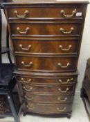 A modern mahogany bow front chest on chest,