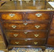 A walnut veneered chest in the early 18th Century manner with two short and three long graduated