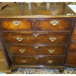 A walnut veneered chest in the early 18th Century manner with two short and three long graduated