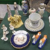 Three Continental porcelain cabinet plates, each with gilt star decorated cobalt blue rims, two