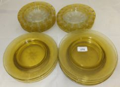 A collection of nine Bohemian style amber and clear cut glass dishes,