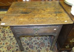 An 18th Century Continental (possibly French) oak side table, the shaped top above a single drawer,