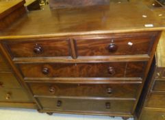 A Victorian mahogany chest of two short and three long graduated drawers on turned feet