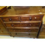 A Victorian mahogany chest of two short and three long graduated drawers on turned feet