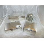 Three rectangular silver sheathed table cigarette boxes, one bearing inscription,