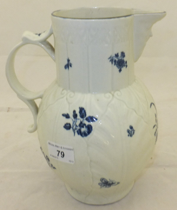 A large Caughley cabbage leaf moulded jug with mask head handle, decorated in underglaze blue with