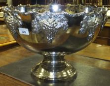 A large white metal punch bowl