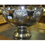 A large white metal punch bowl