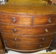 A Victorian mahogany bow fronted chest of two short and three long graduated drawers on splayed